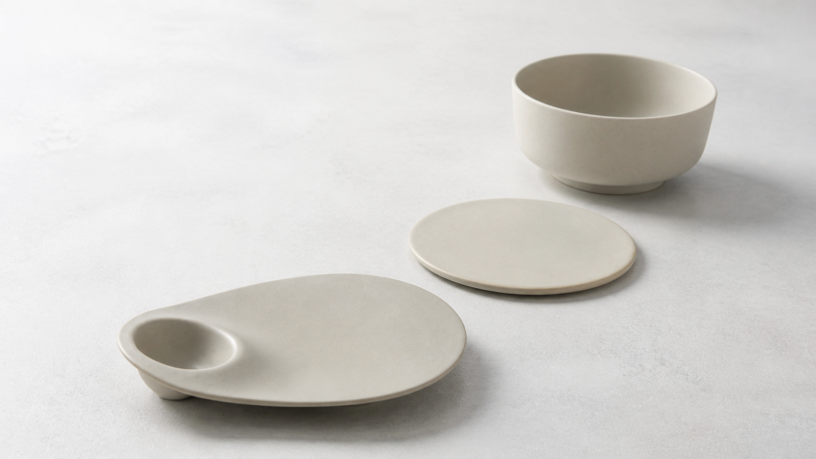 Quiet Geometry bowl, flat plate and dumpling platter in a natural diagonal arrangement