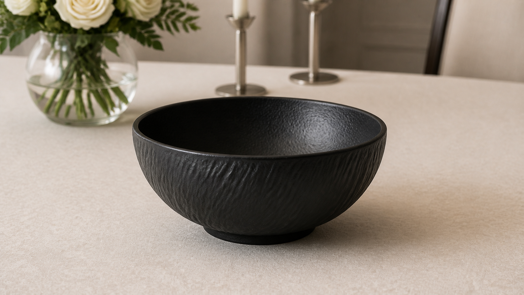 Close view of a Shadow Grain deep black soup bowl showing the carved exterior texture