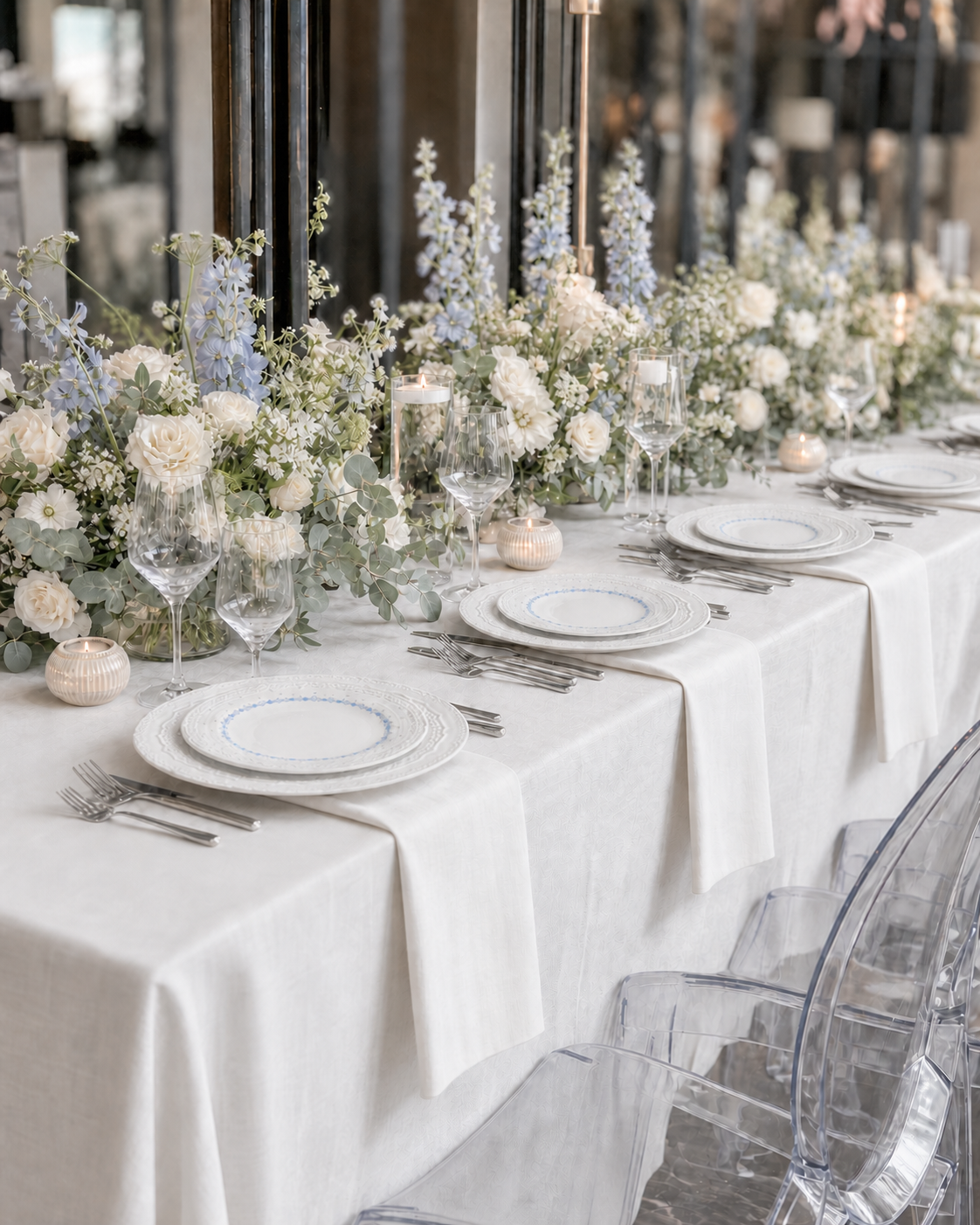 Garden Table blue floral relief dinnerware arranged along a white garden table