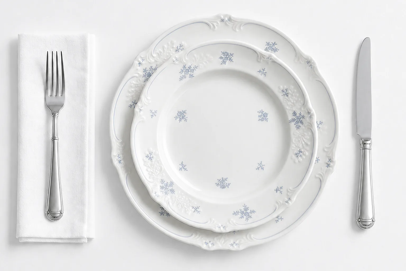 Sculpted Petal plates centred in a complete place setting