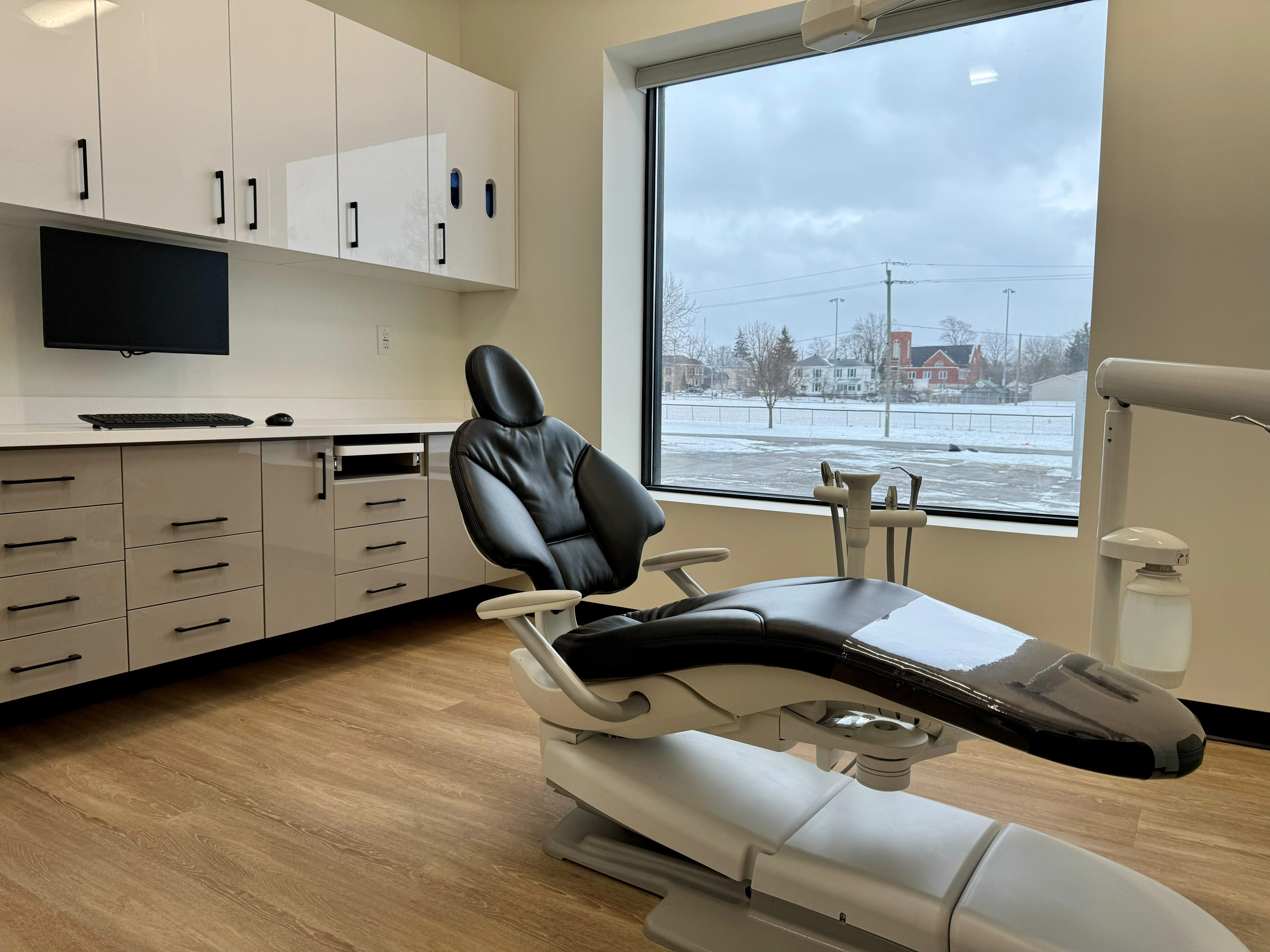 Modern dental treatment room at Family Dental Care Cayuga with a patient dental chair and clinical equipment