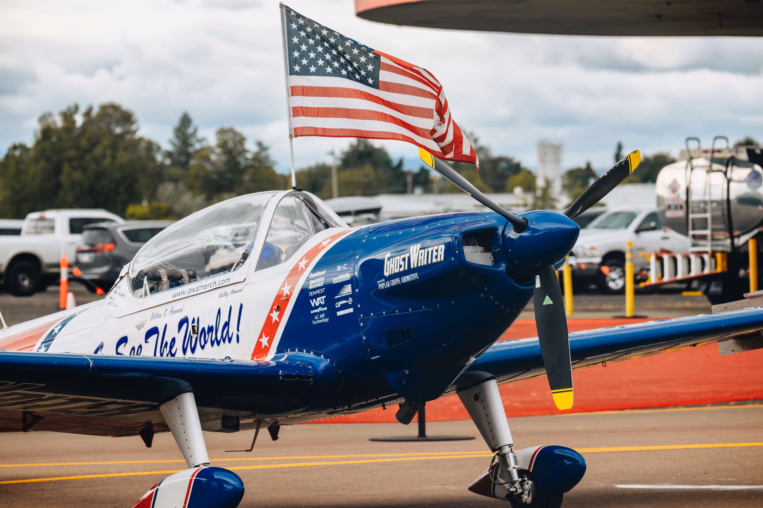 plane with american flag flying on top