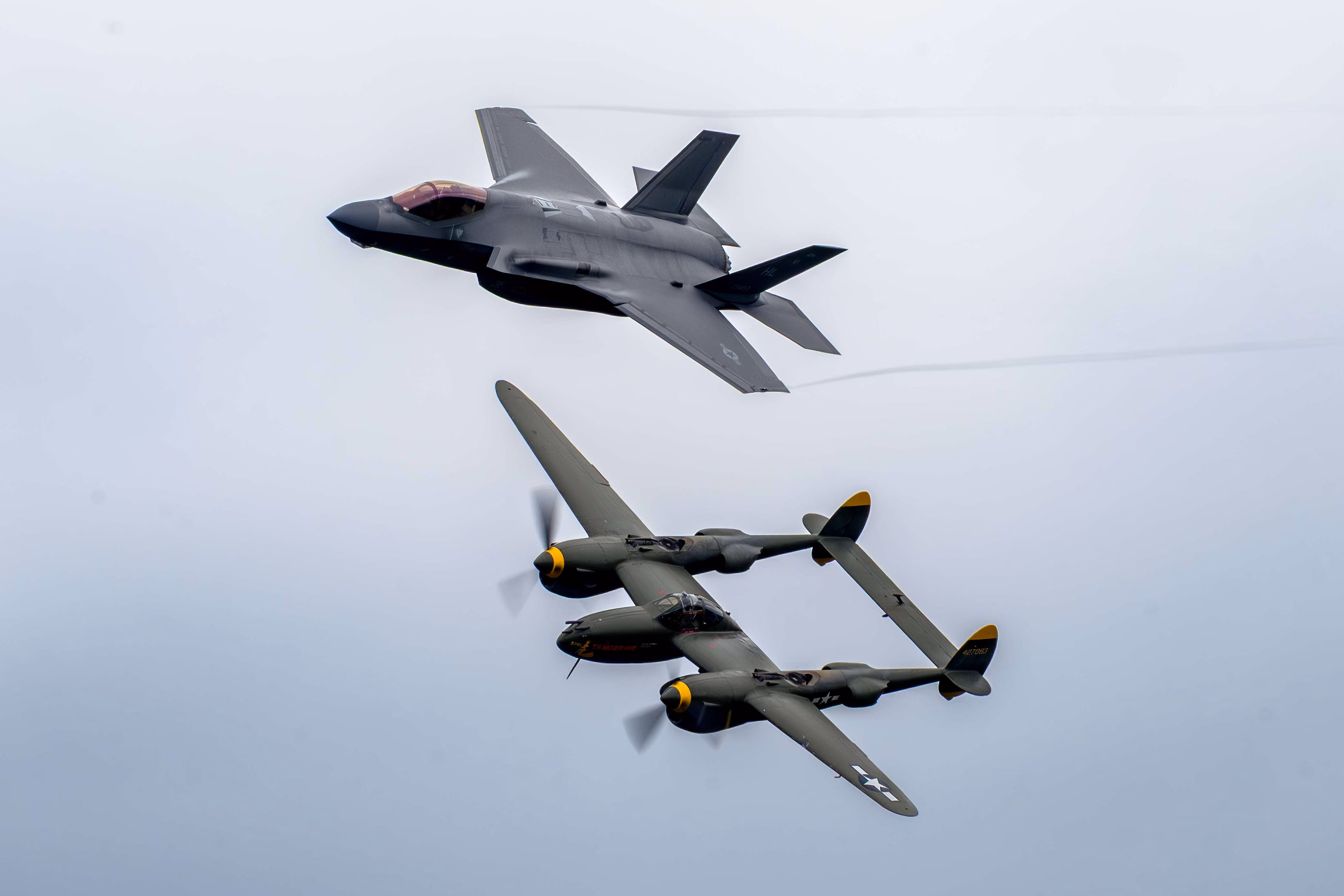 Two planes flying in the air