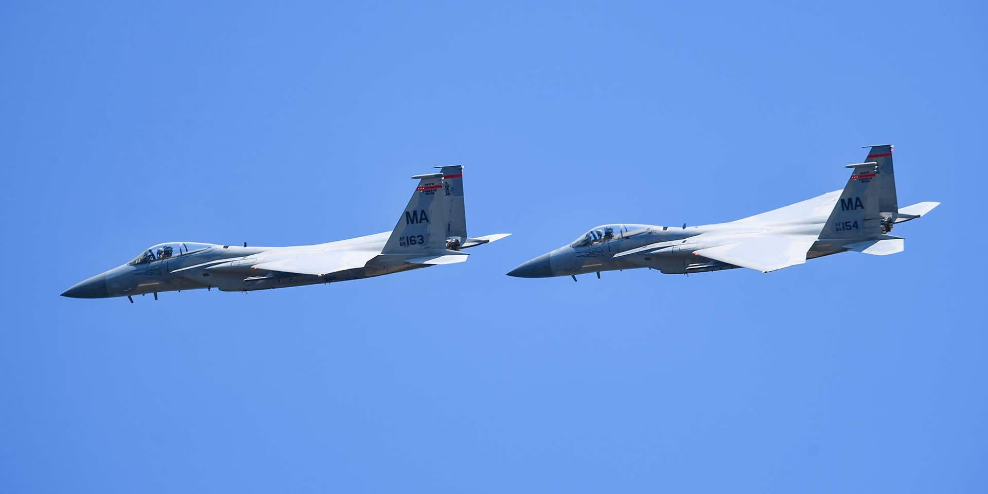 Two F-15 planes in the air