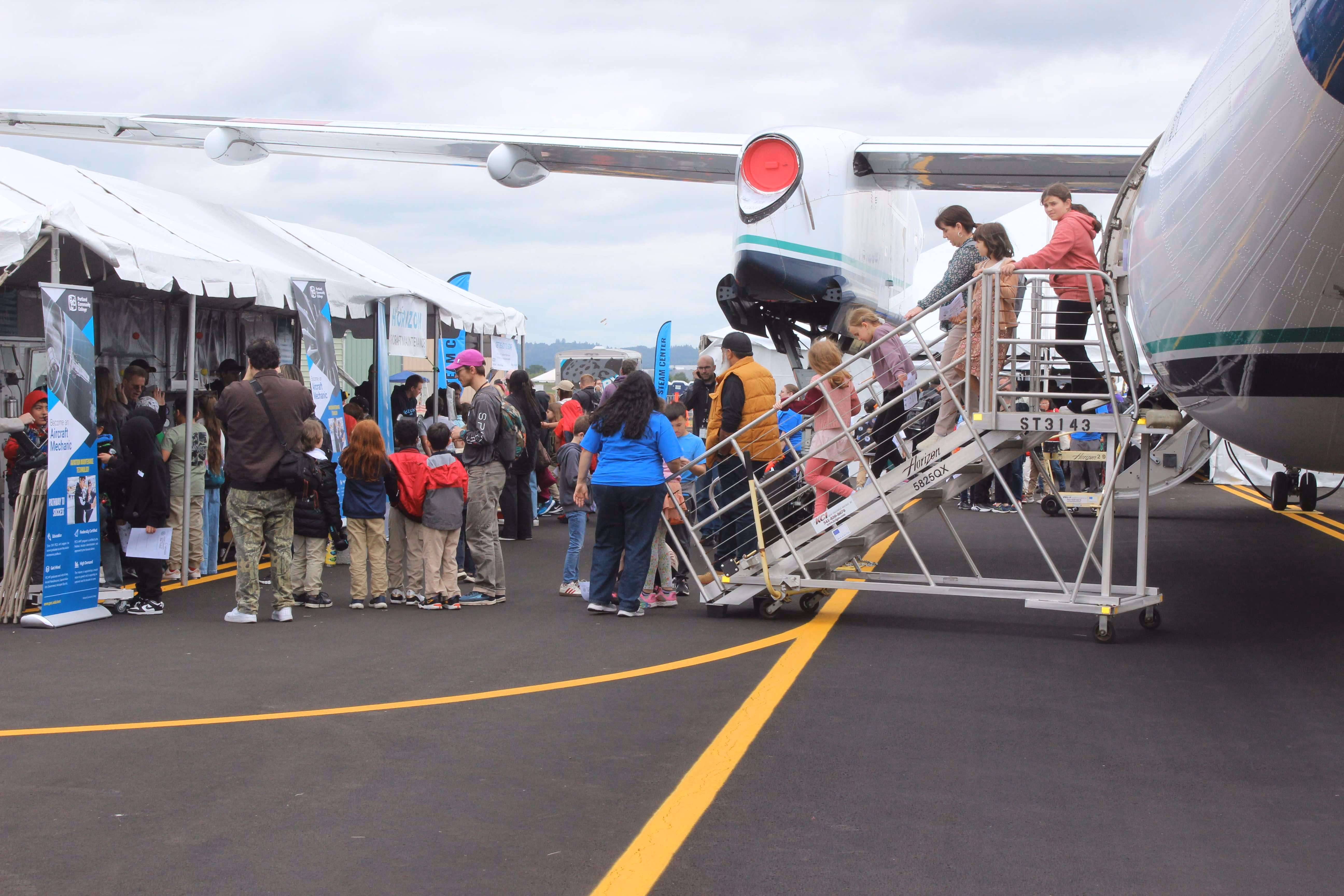 line of people entering plane