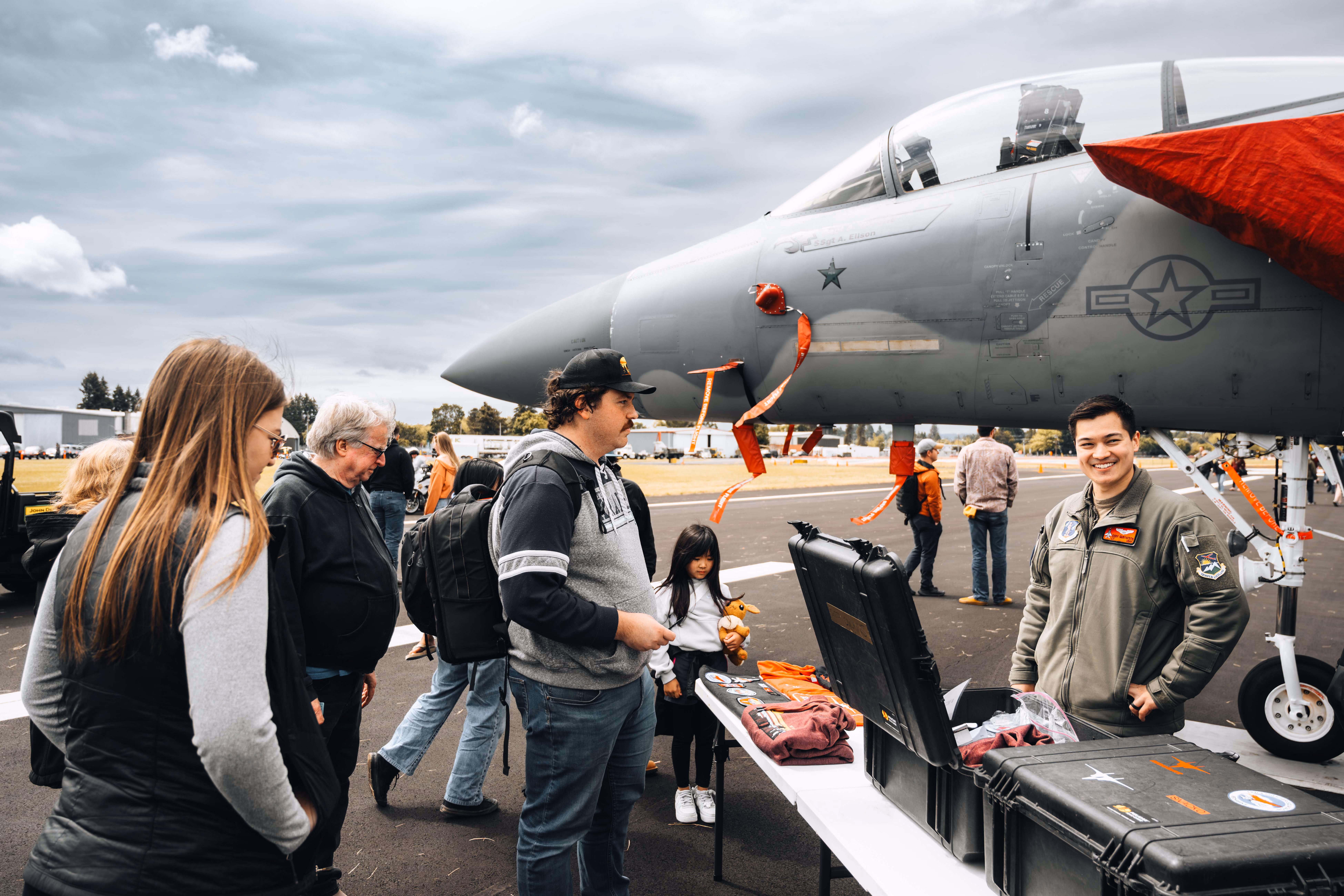 line of people in front of plane