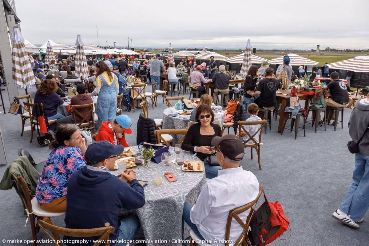 group of people gathering at outdoor table