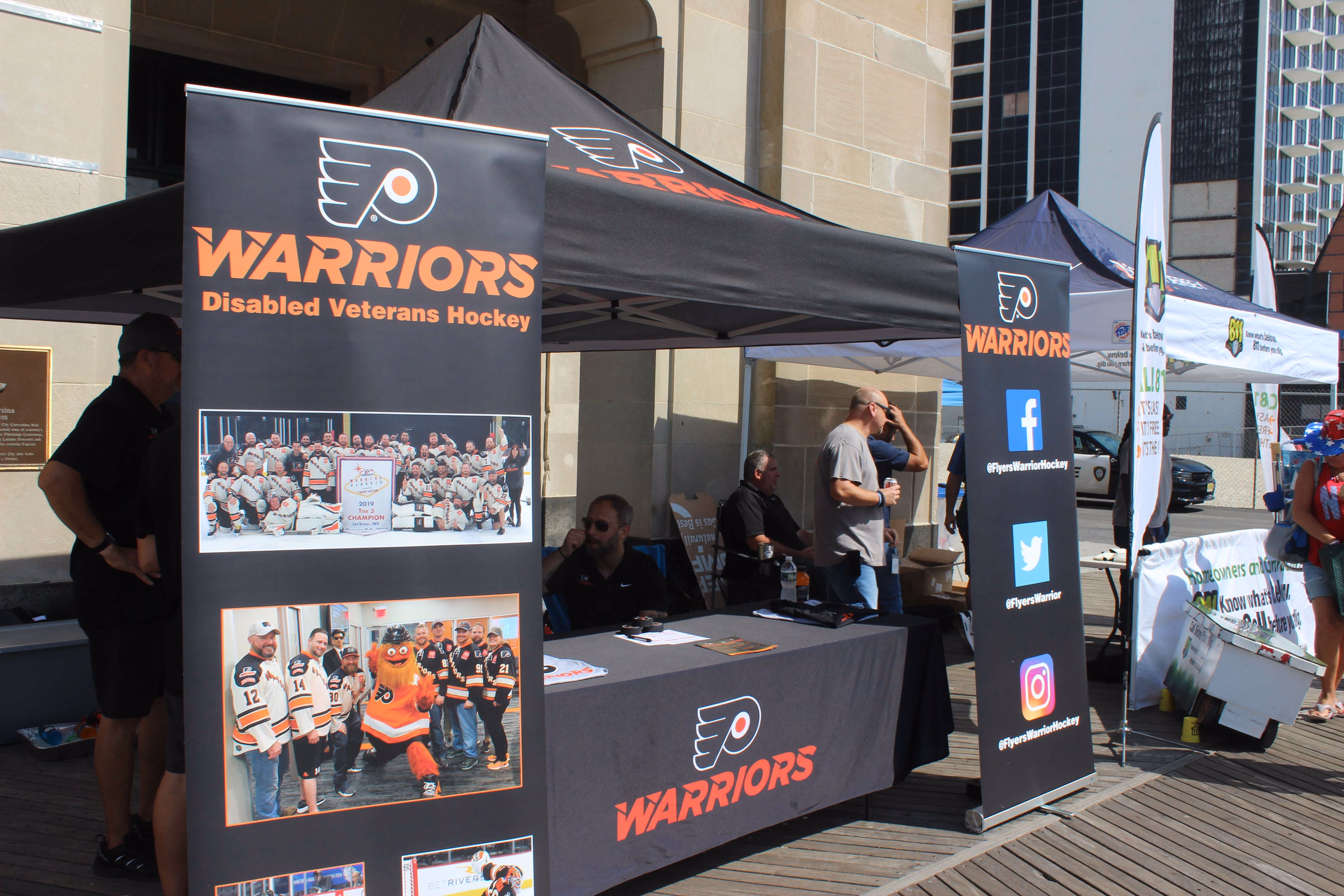 black warriors marketing tent with standing displays