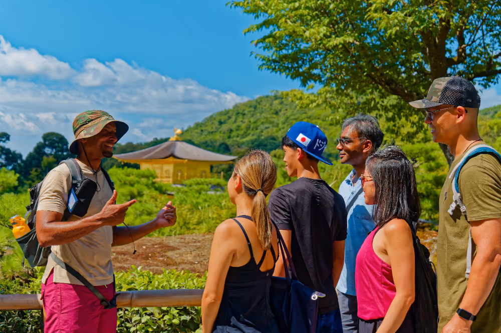 A local private tour guide leading guests through a quiet neighborhood in Kyoto with City Rocker Tours.