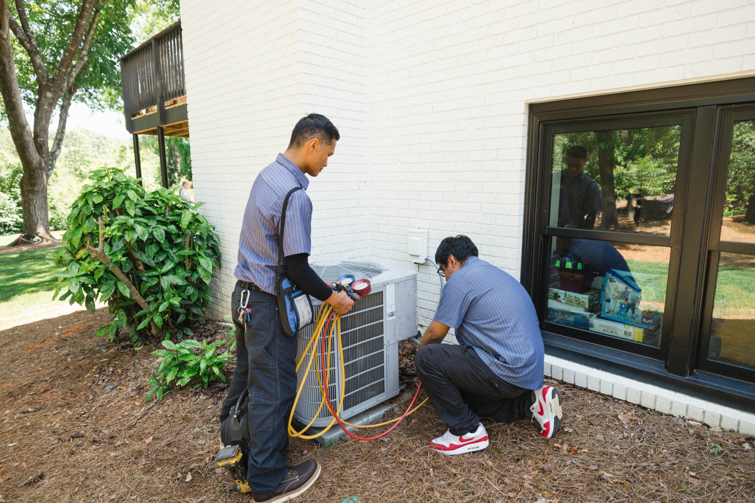 HVAC technician providing home service