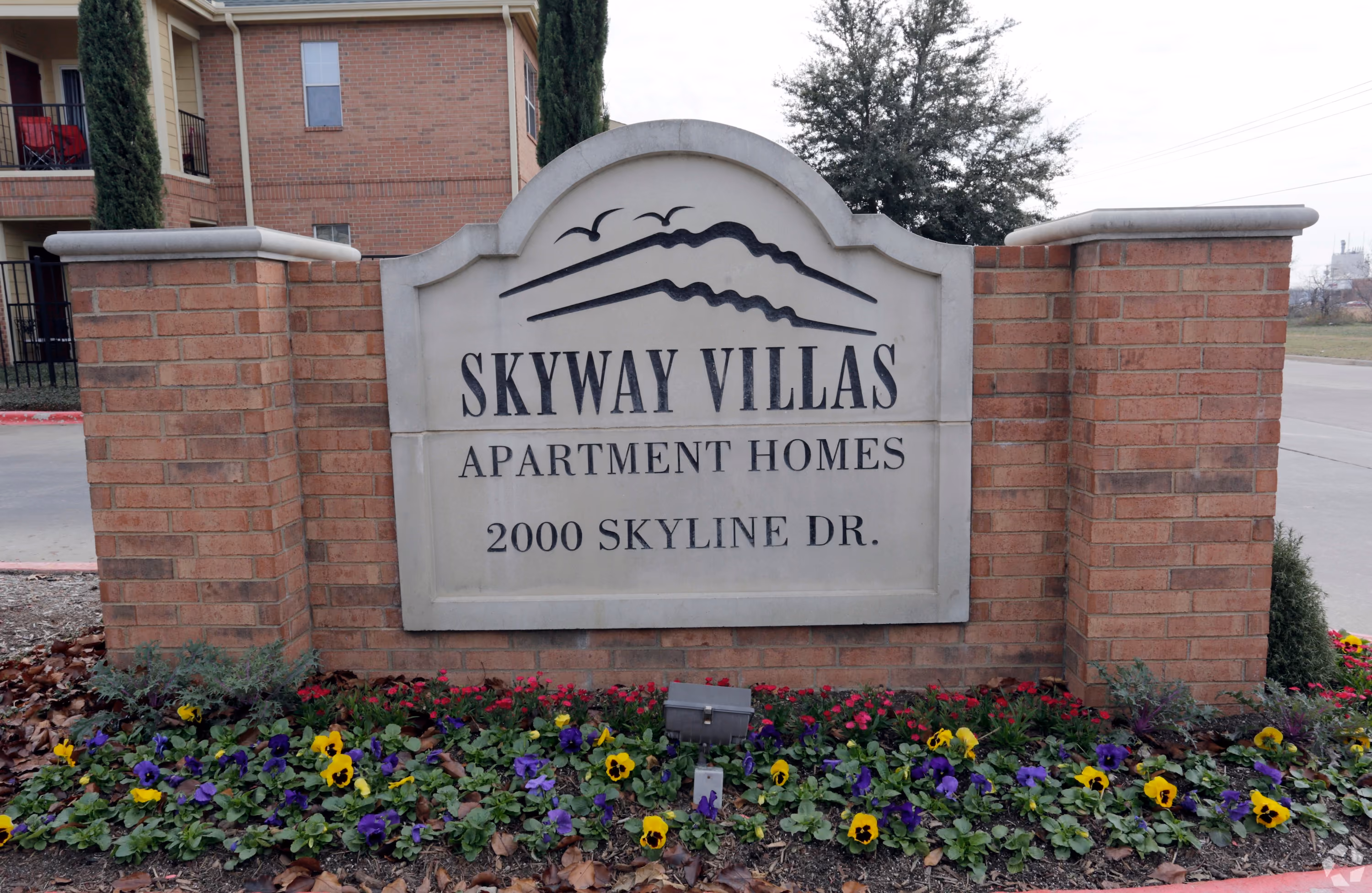 Exterior of community building with brick sign