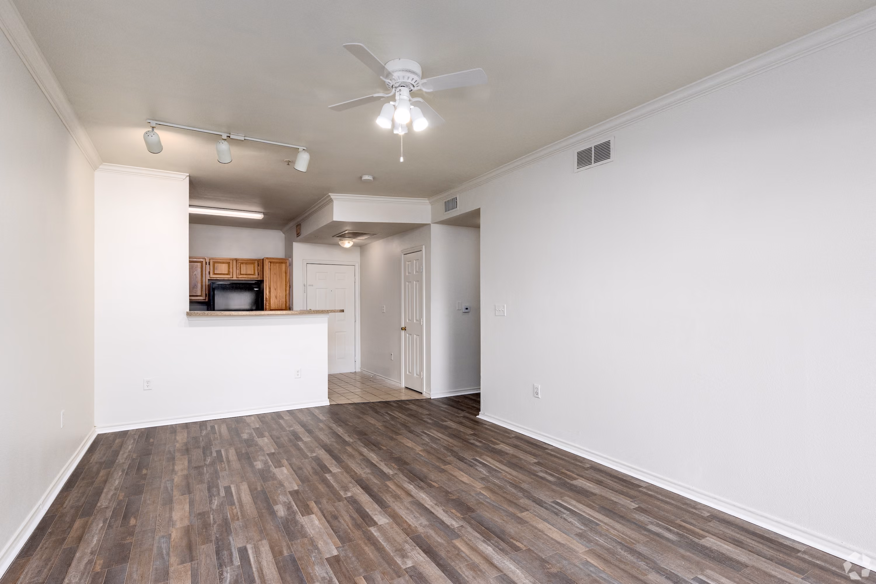 Empty apartment with carpet and white walls