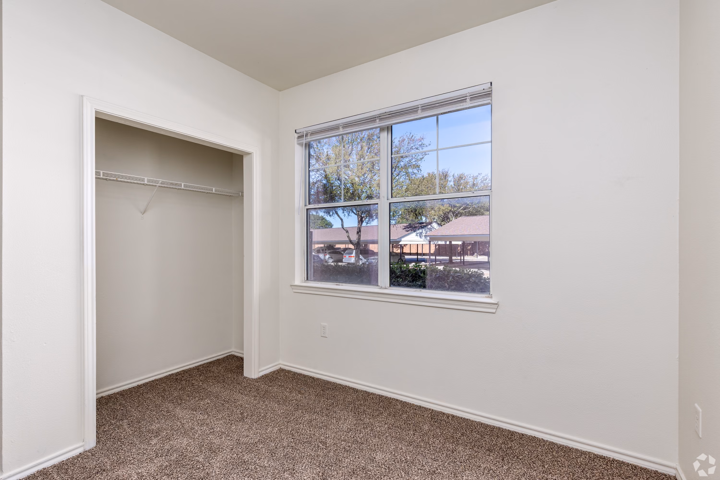 Empty apartment with carpet and white walls