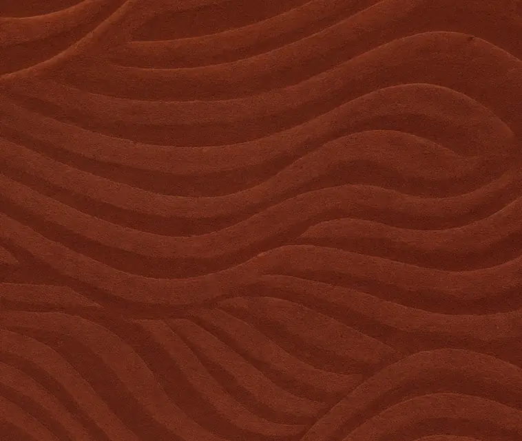 Gros plan sur une fibre textile aux tons terracotta