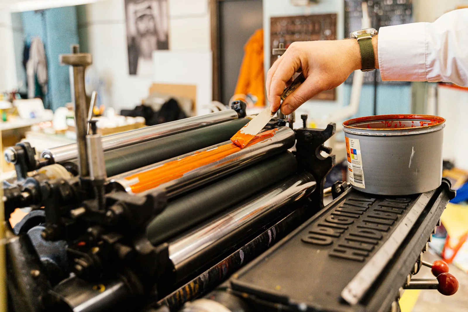 Ink worked across the rollers of a press