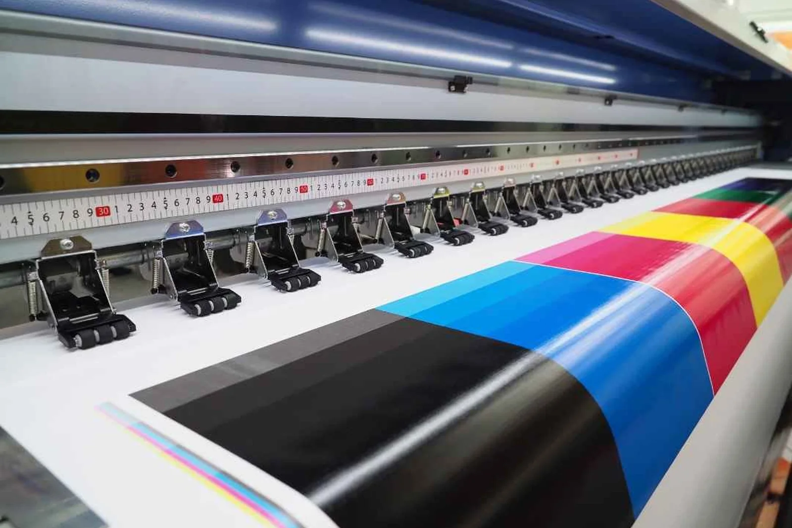 A four-color press running a sheet