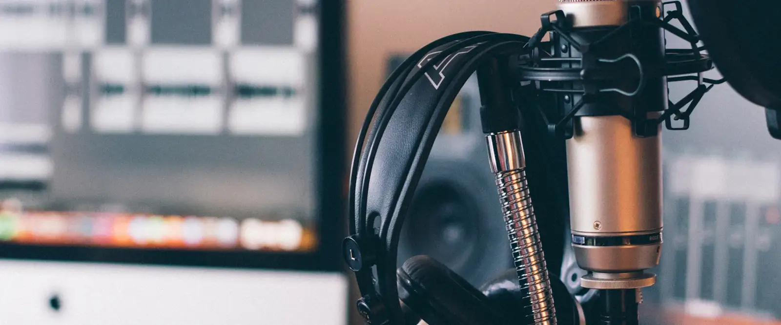 Studio microphone and headphones set up for a podcast recording