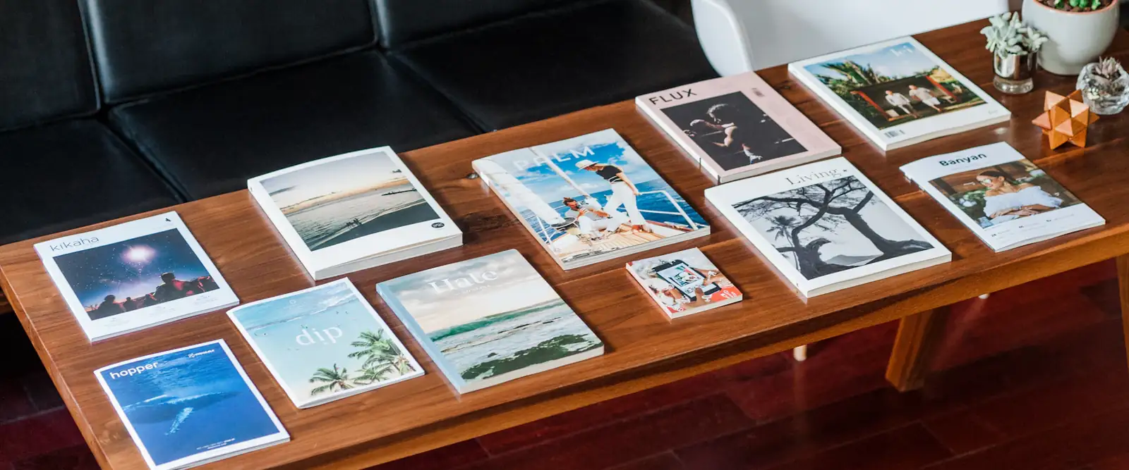 Printed magazines and booklets laid out on a table