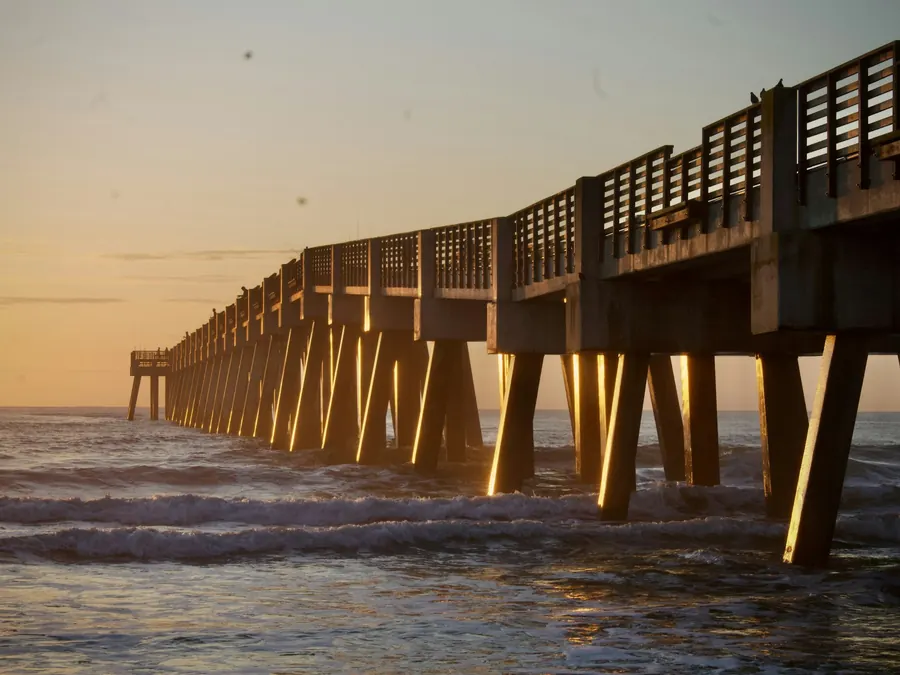 A concrete fishing pier at sunrise on the Atlantic coast