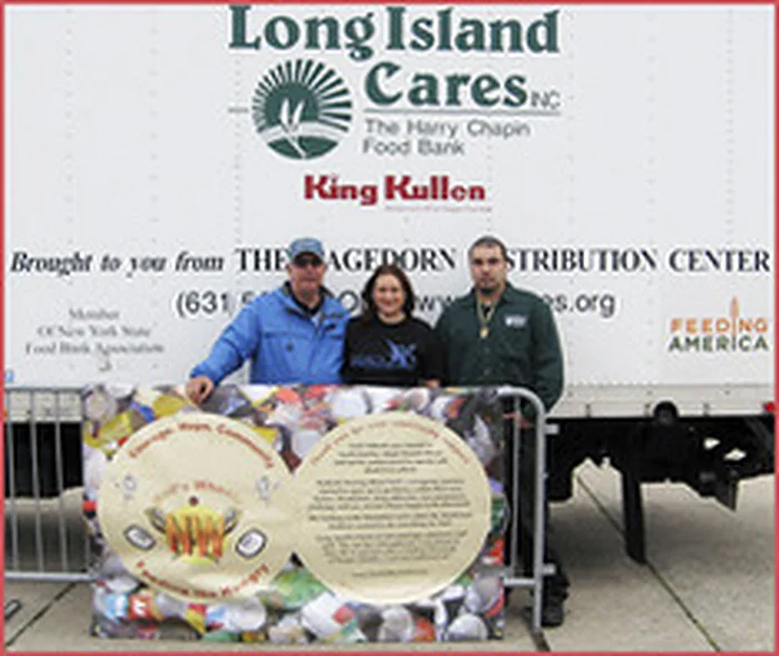 Neil's Wheels display in front of a Long Island Cares food bank truck