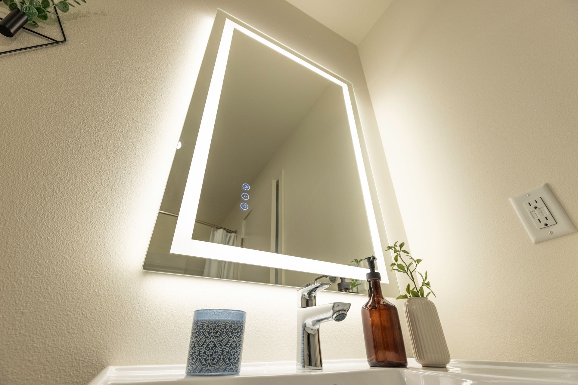 Backlit vanity mirror in the bathroom