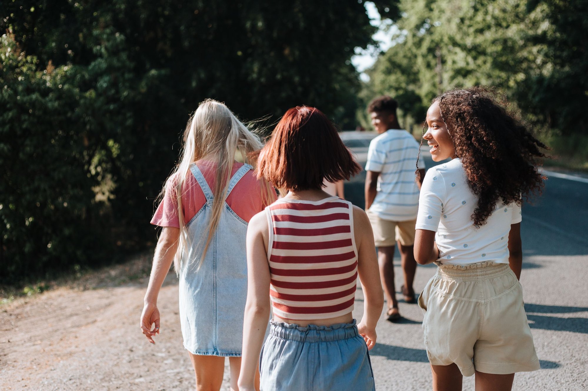 Two teenagers walking side by side