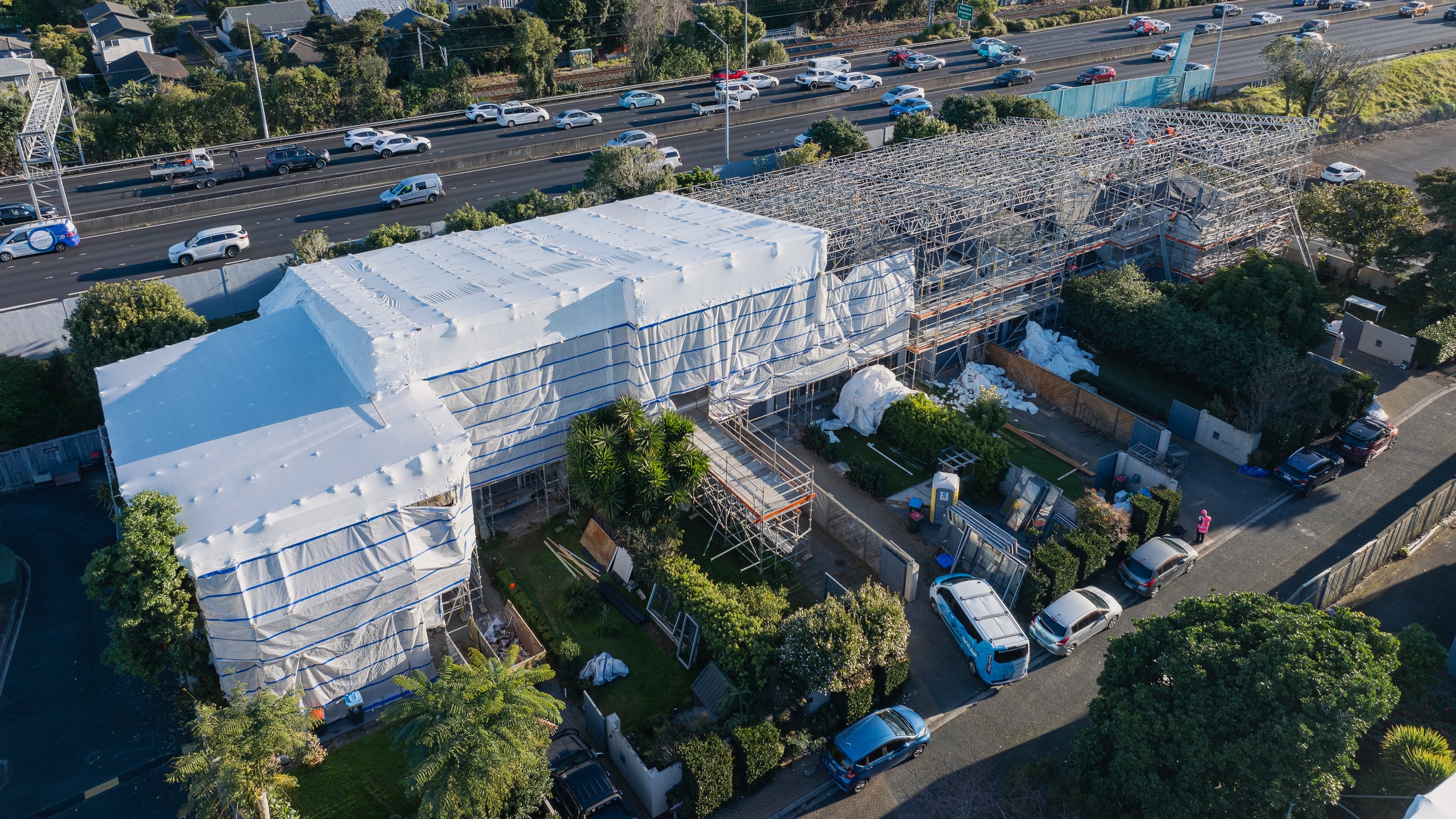 Scaffolding and new cladding during a multi-unit reclad at Ascot Villas, Auckland