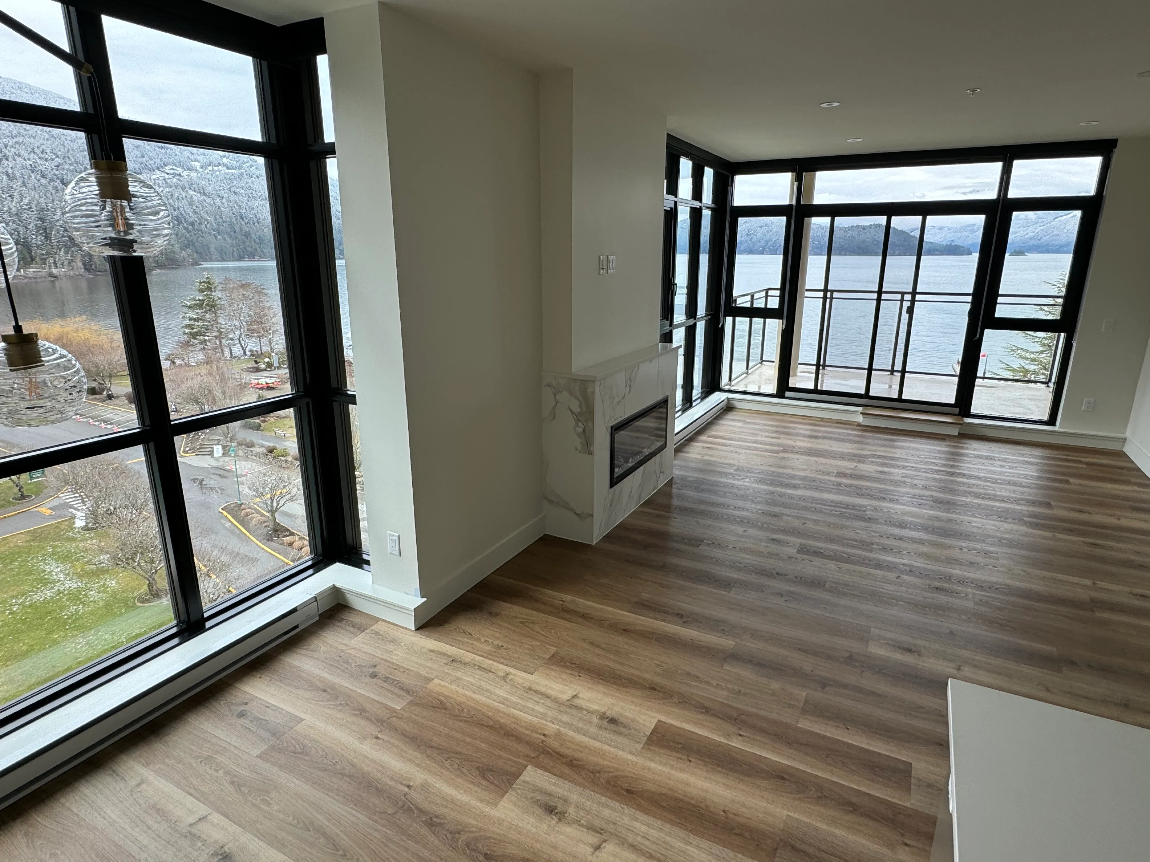 Wide-plank hardwood flooring through an open living level, Metro Vancouver