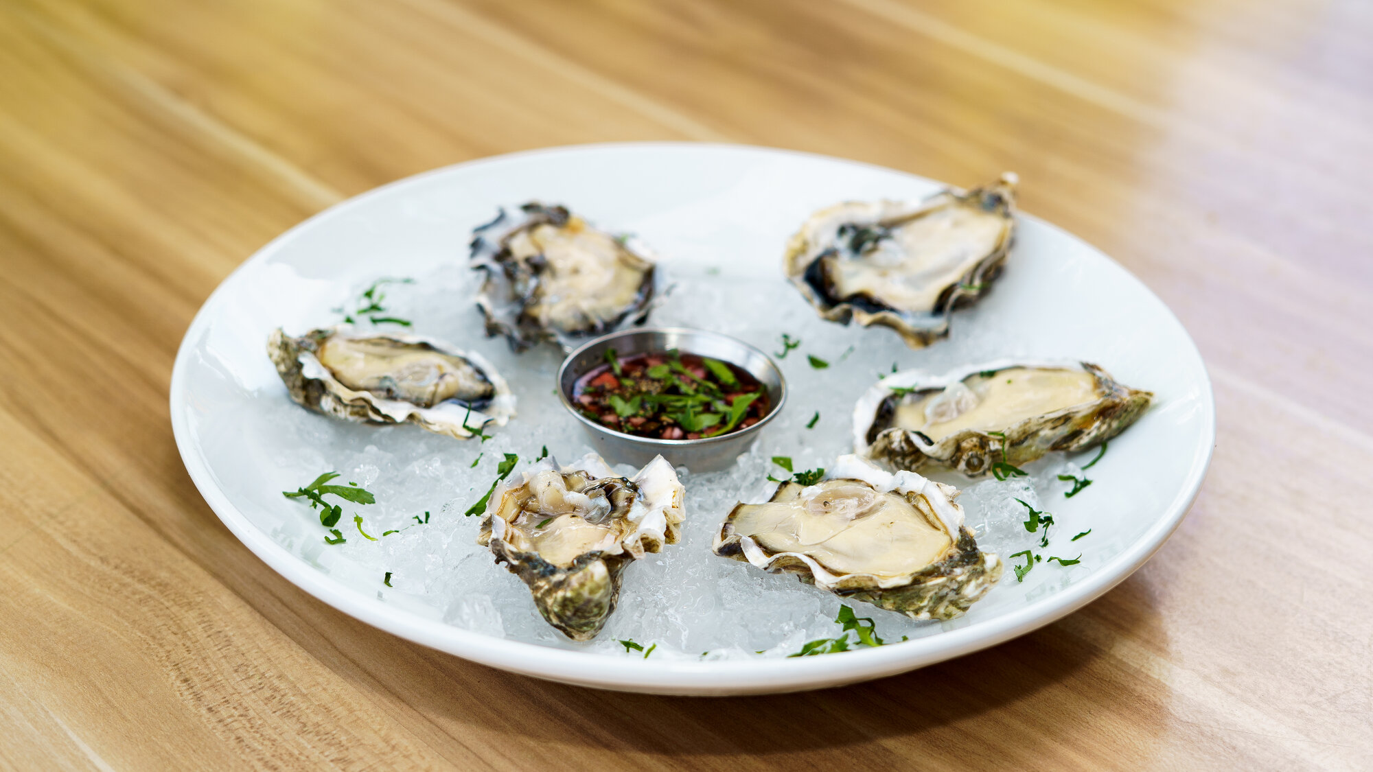 Fresh oysters on ice with mignonette at Napkins Bar & Grill