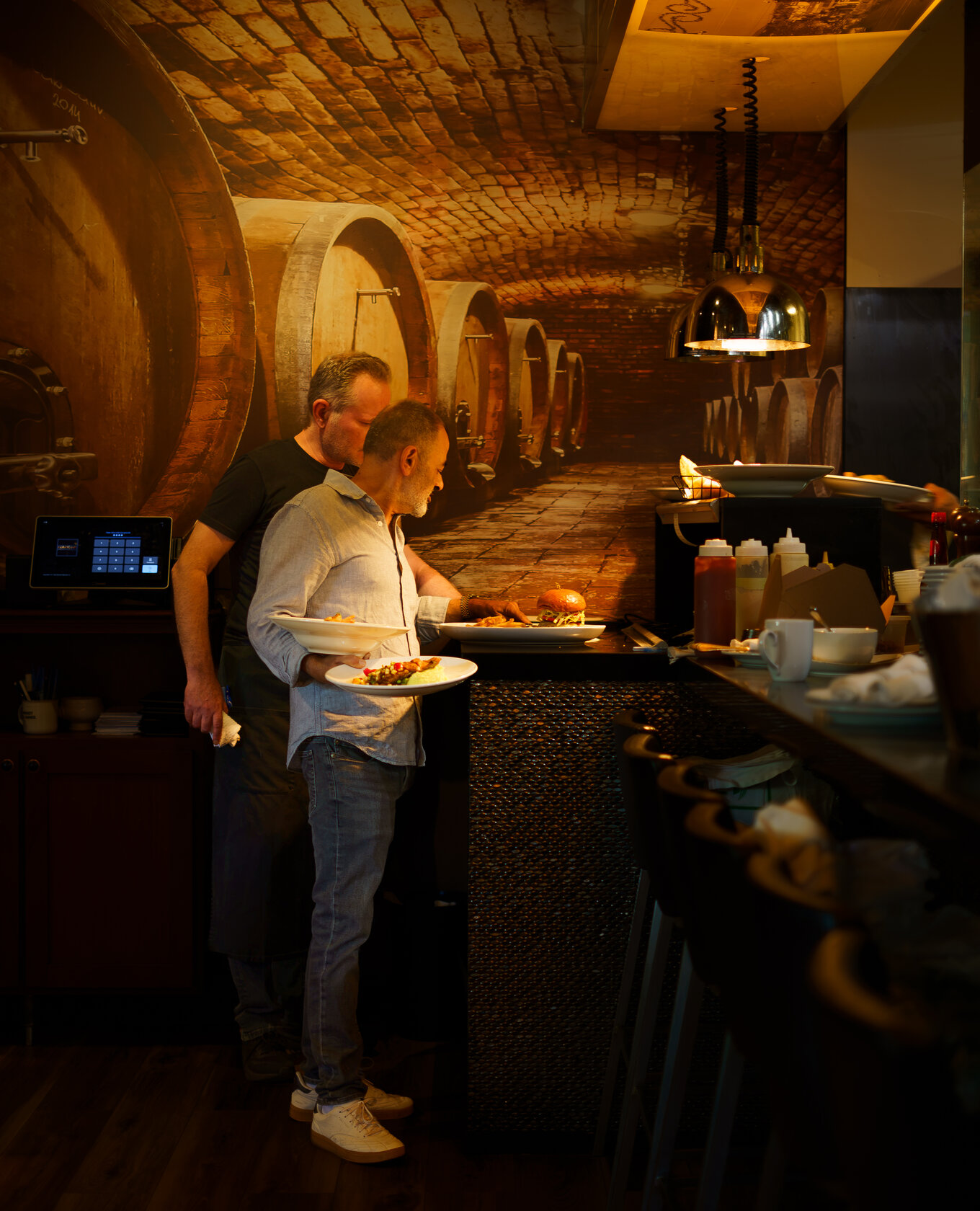 Napkins staff serving plates at the bar