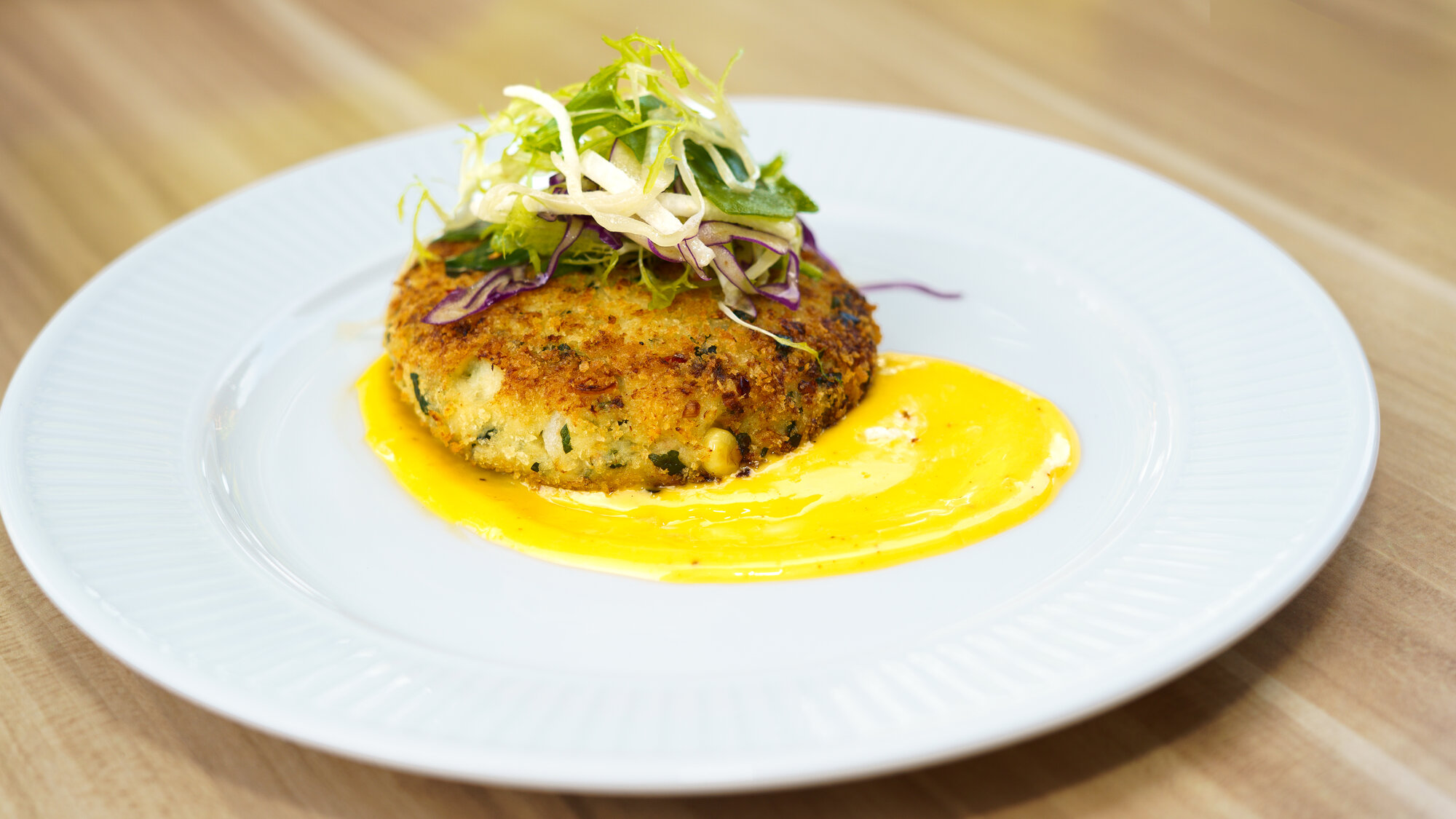Crab cake with slaw at Napkins Bar & Grill