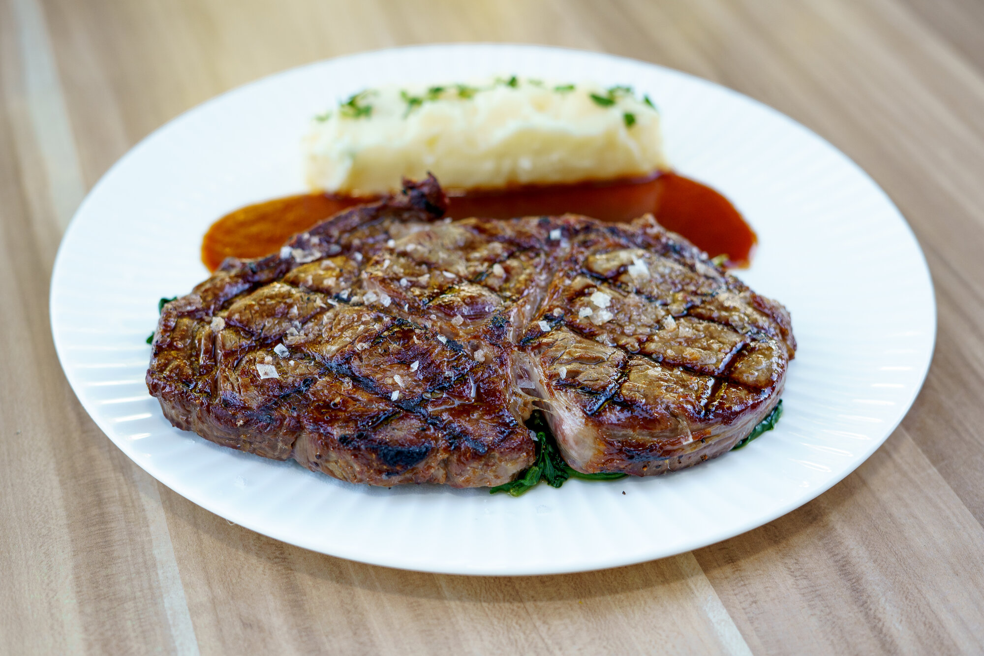 Ribeye steak with mashed potatoes at Napkins Bar & Grill