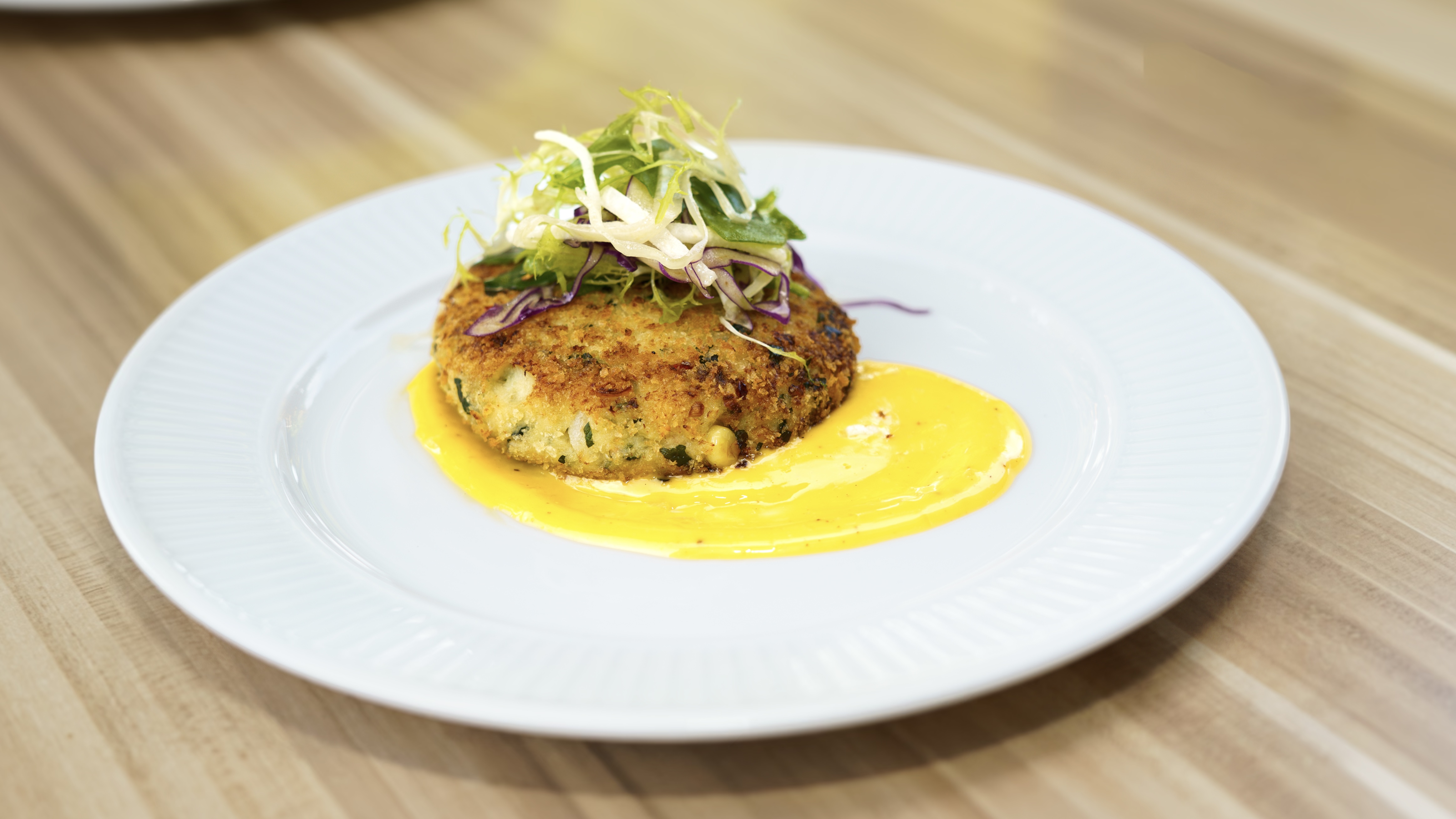 Crab cake with slaw at Napkins Bar & Grill