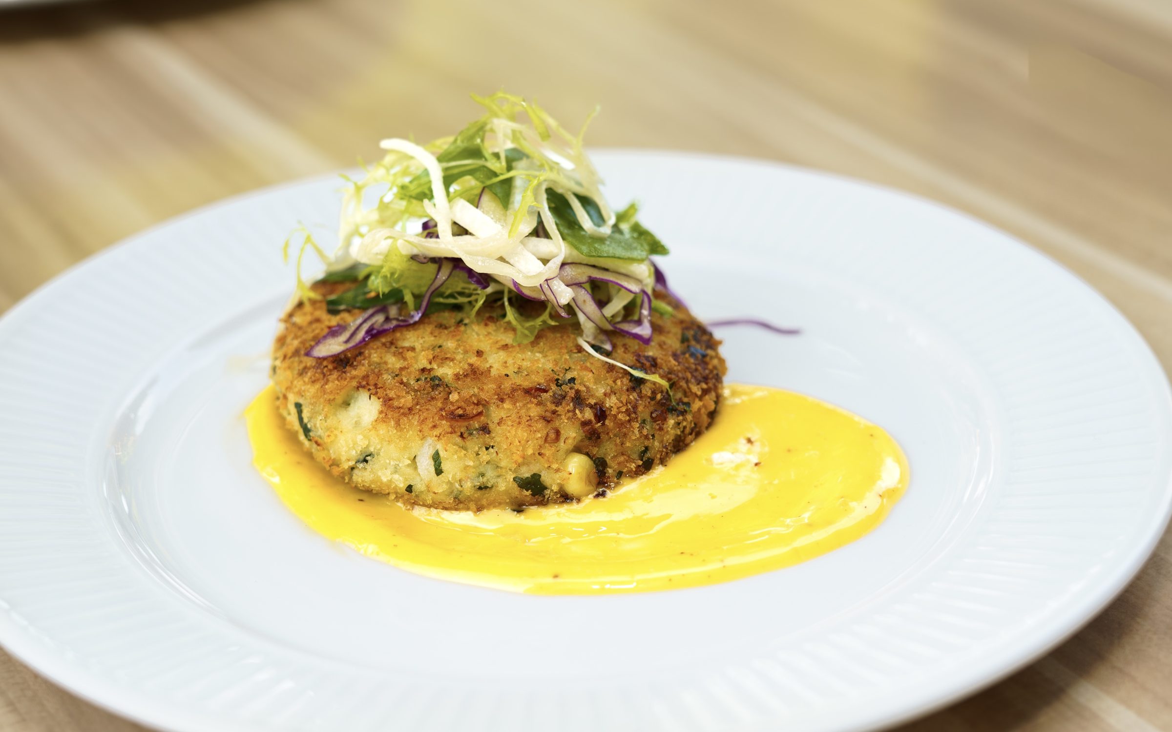 Crab cake with slaw at Napkins Bar & Grill