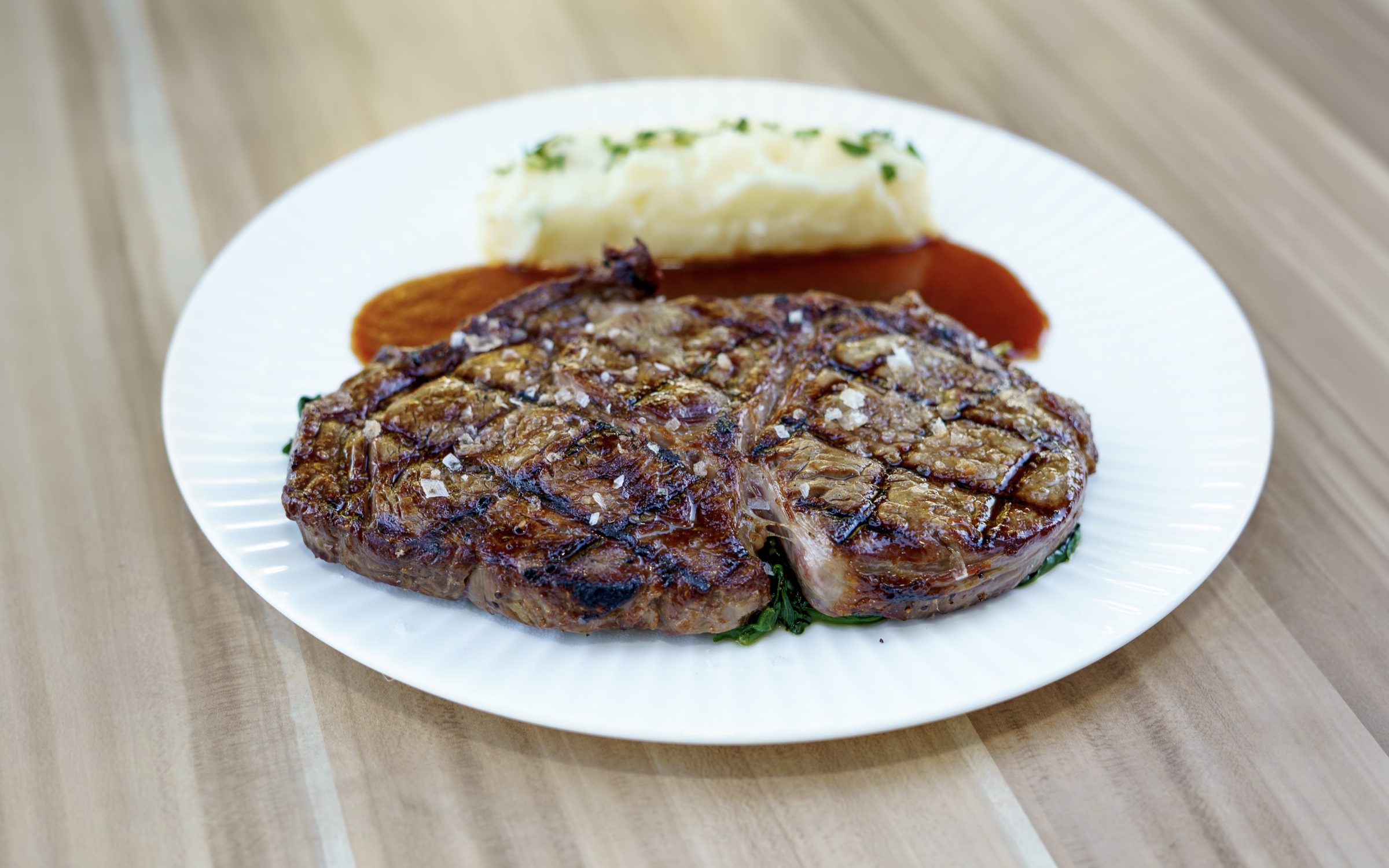 Ribeye steak with mashed potatoes at Napkins Bar & Grill