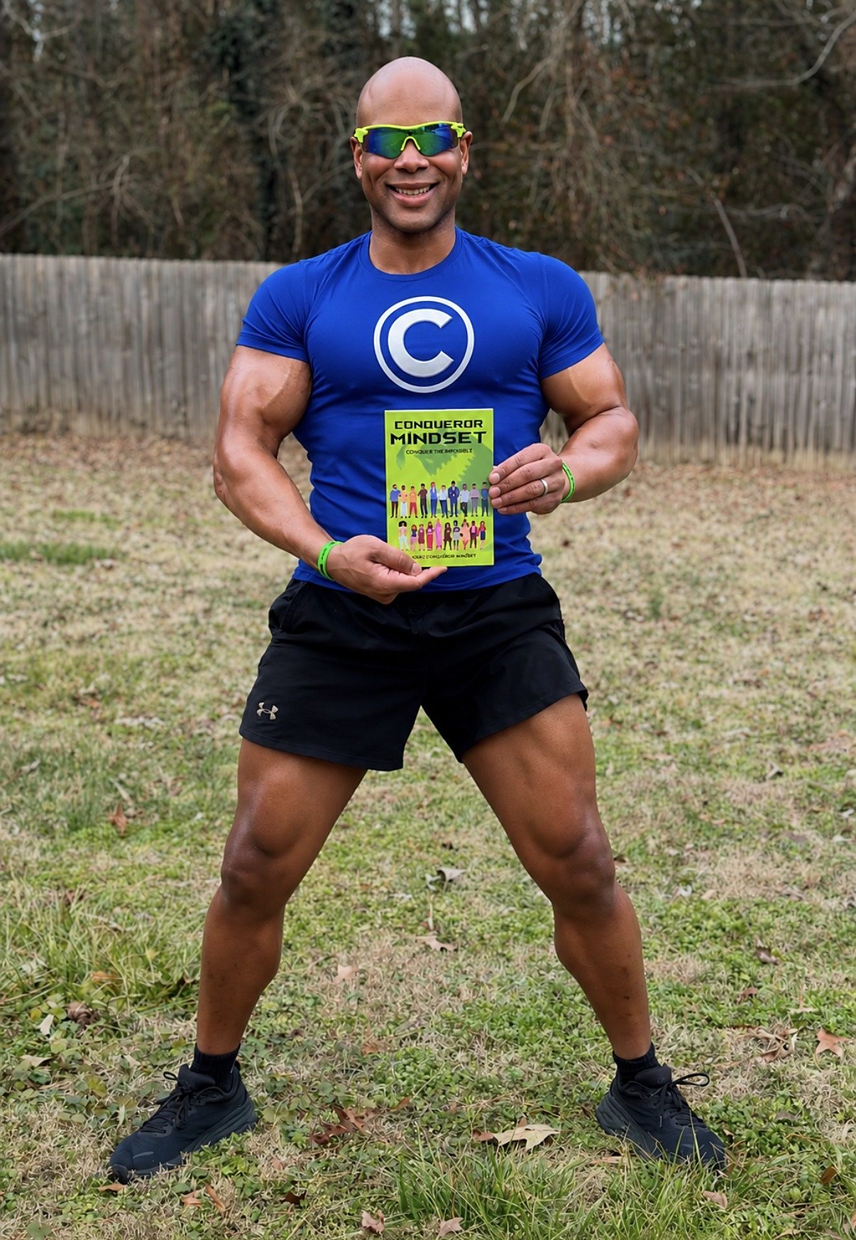 Conqueror Roberts holding his book Conqueror Mindset: Conquer the Monster