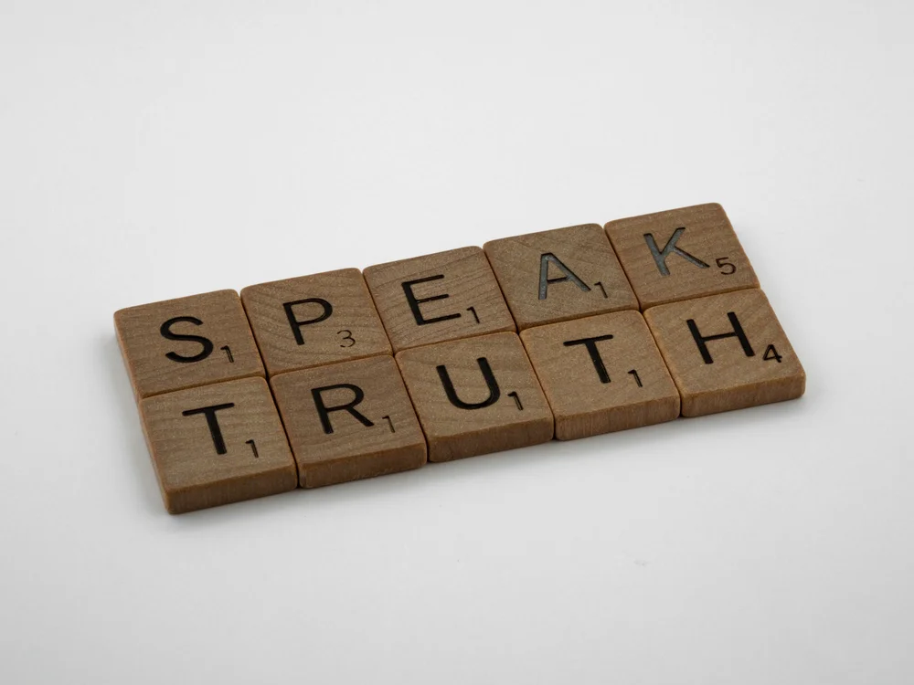 Letter tiles spelling out the words speak truth