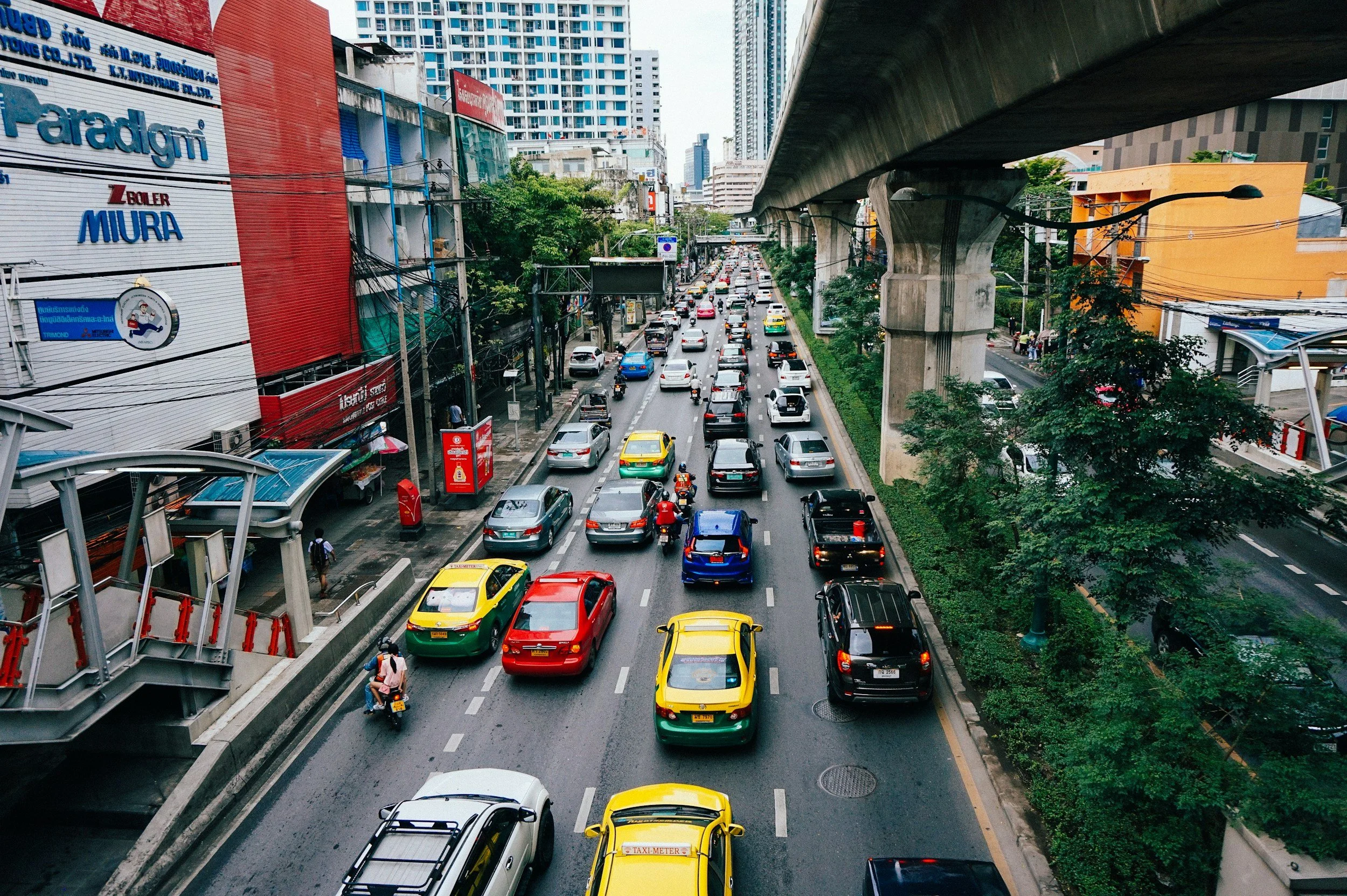 A busy multi-lane city street packed with traffic