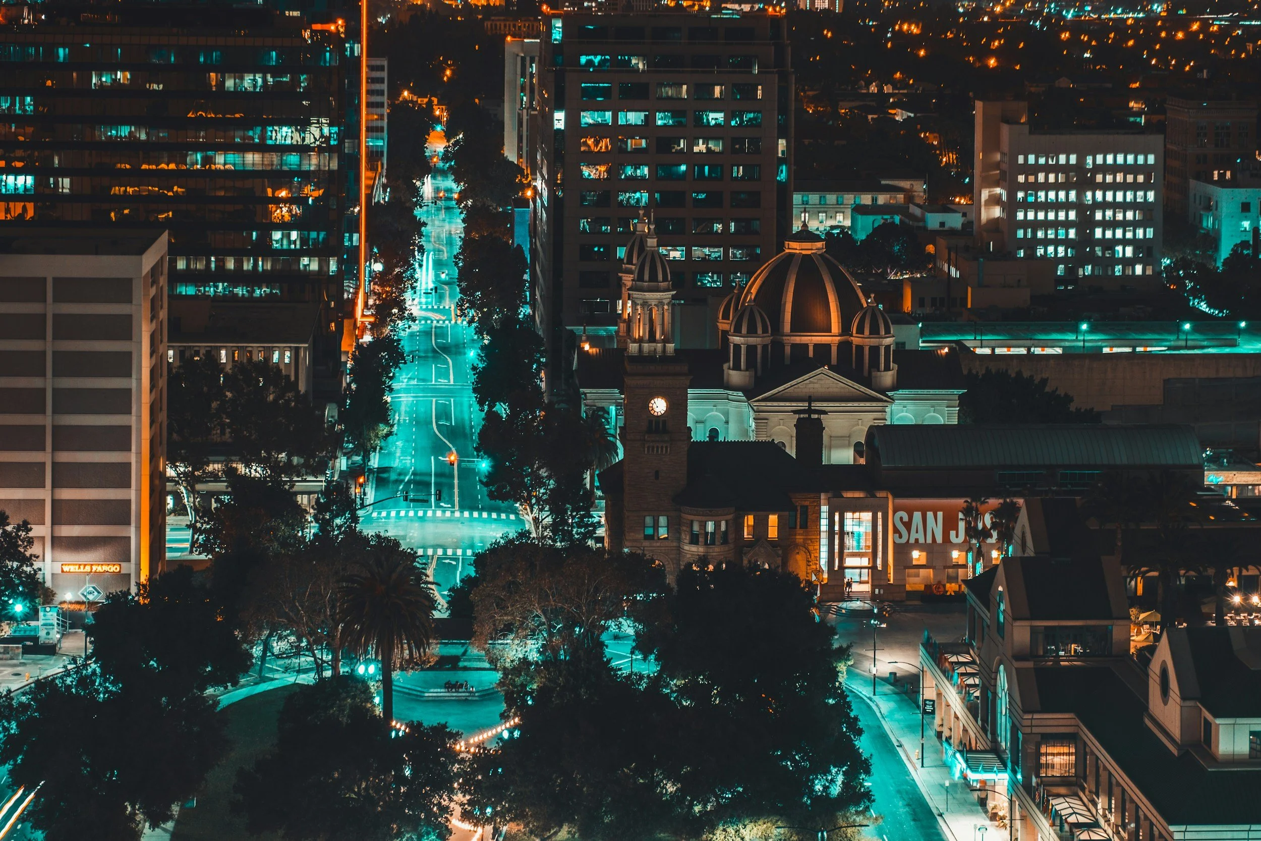 Downtown San Jose lit up at night, seen from above