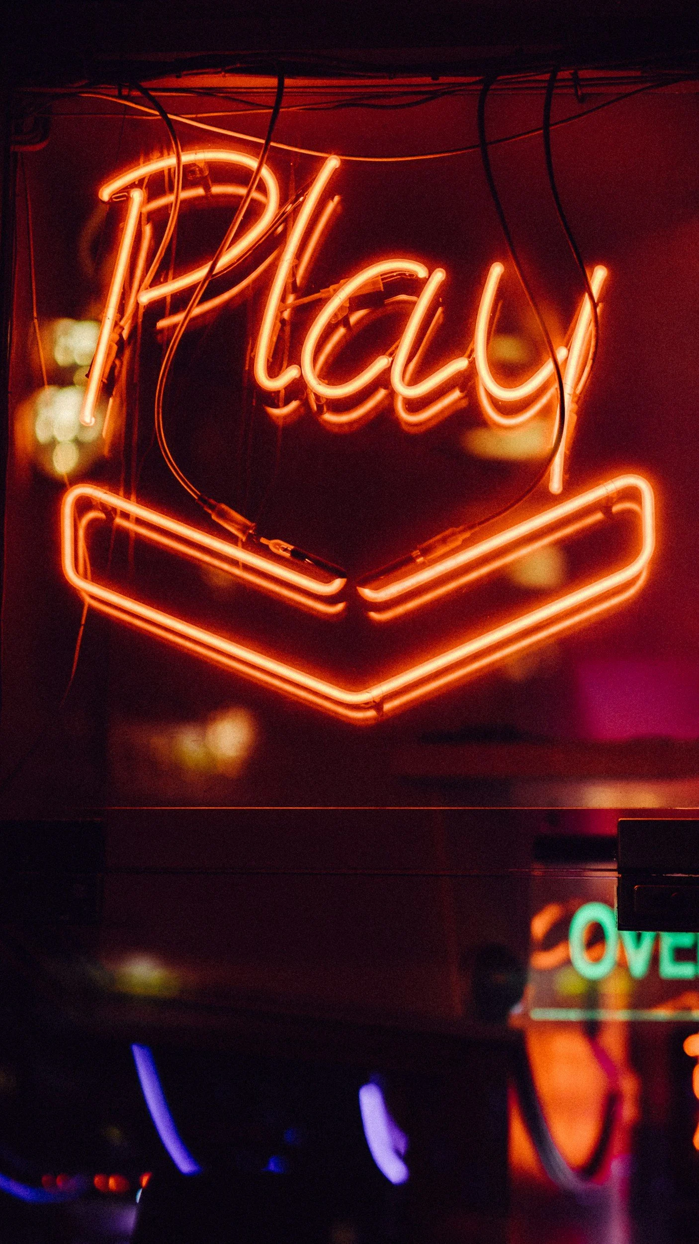 A neon sign reading Play