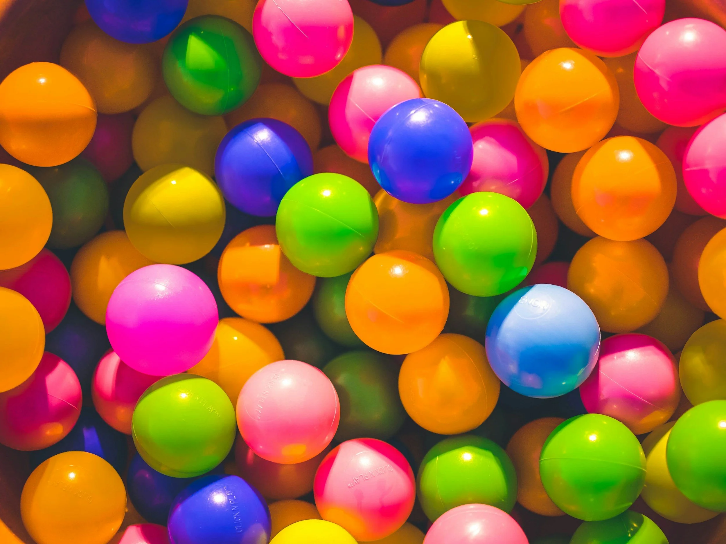 A pile of brightly coloured plastic ball-pit balls