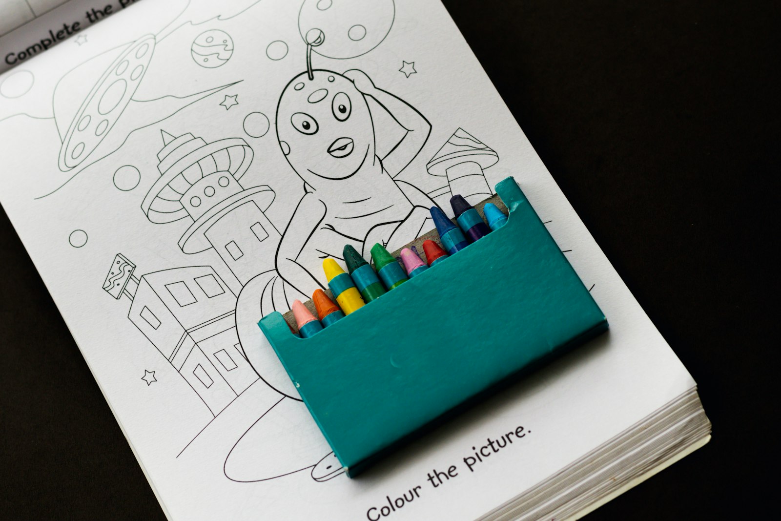 Crayons in a holder on a table in a child therapy playroom