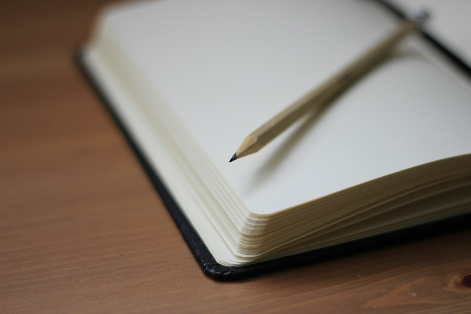 An open notebook and pencil ready for a letter to a new teacher