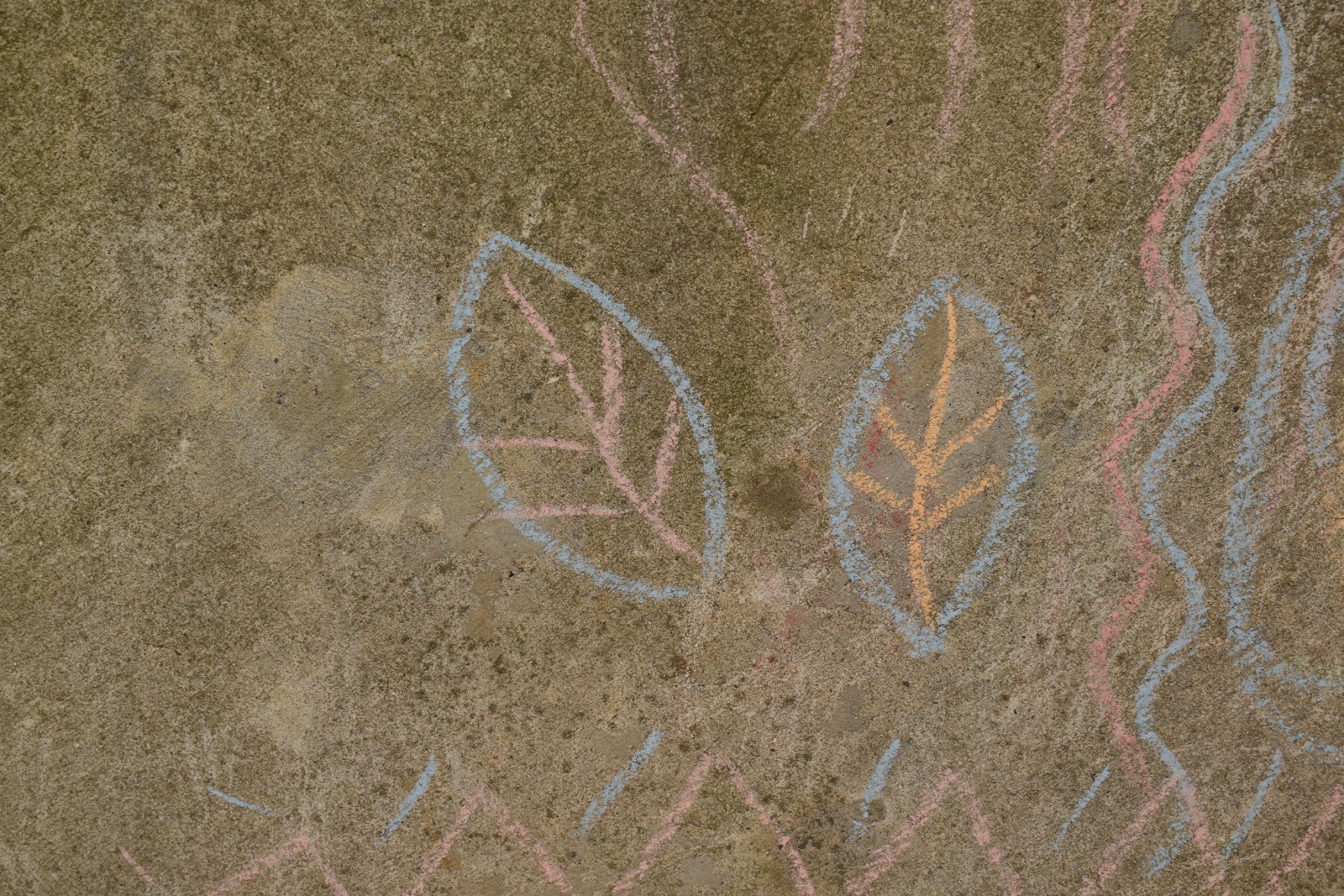 Chalk drawings on playground pavement at recess, child therapist San Jose