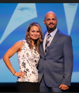 Jess and Josh Rosenberg on stage at an event
