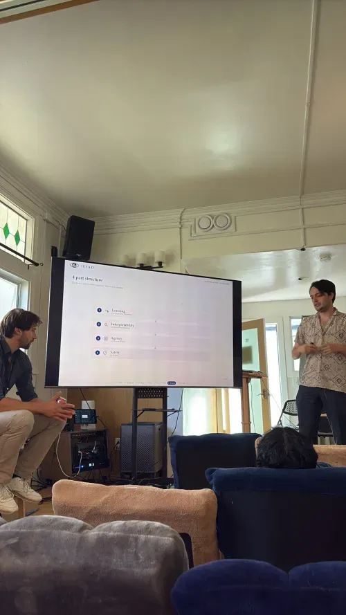 Iliad presentation with participants seated indoors