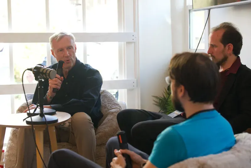 Small group in conversation during an Iliad gathering