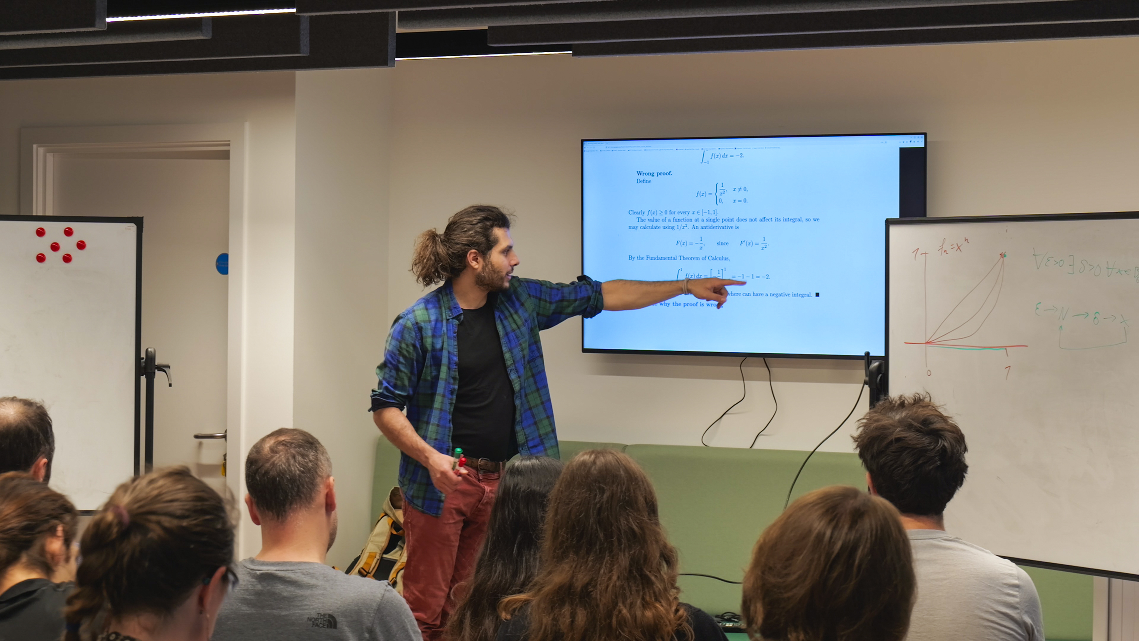 An Iliad Intensive teacher walking participants through a proof.