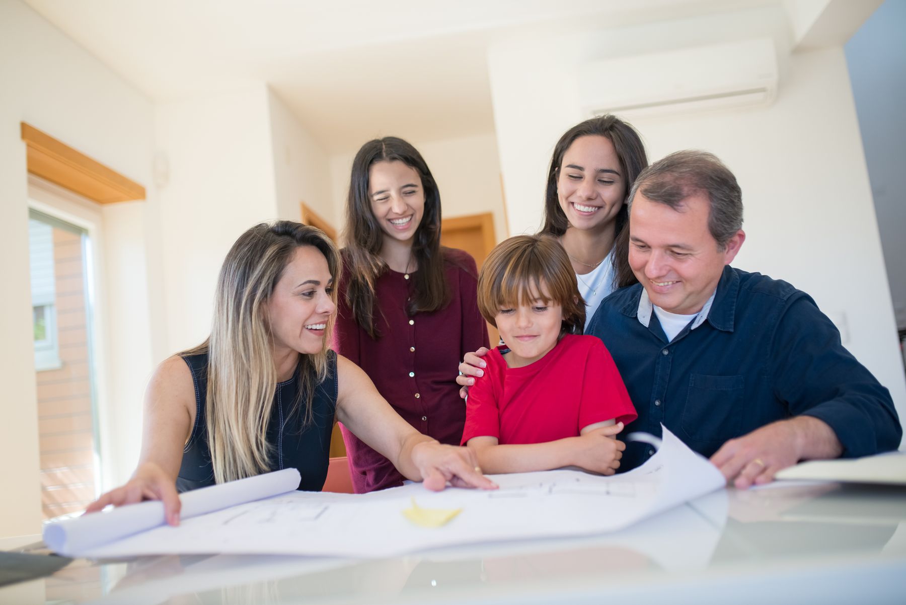 Homeowners reviewing a residential plan together at a table