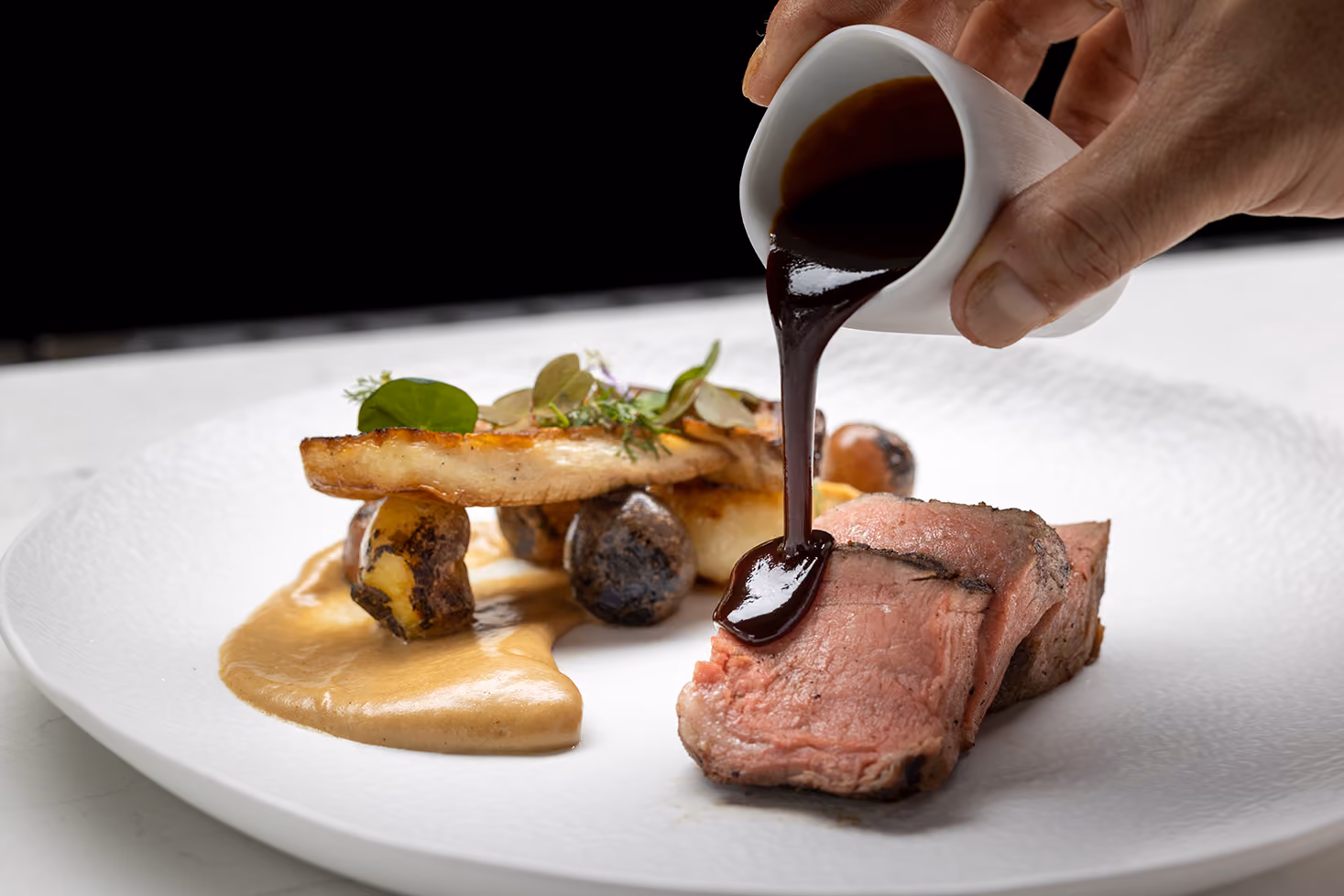 Gourmet steak plating captured by NYC restaurant and hospitality photographer Hernan Valle.